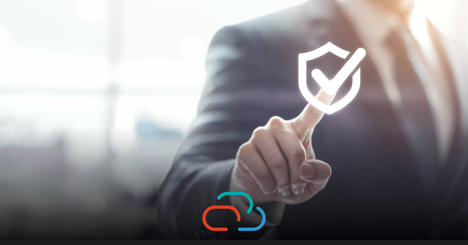 A businessman checks a floating shield icon to protect from malware and cybersecurity attacks.